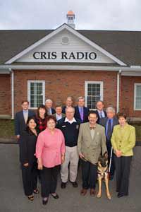 CRIS volunteers stand in front of Windsor Studio