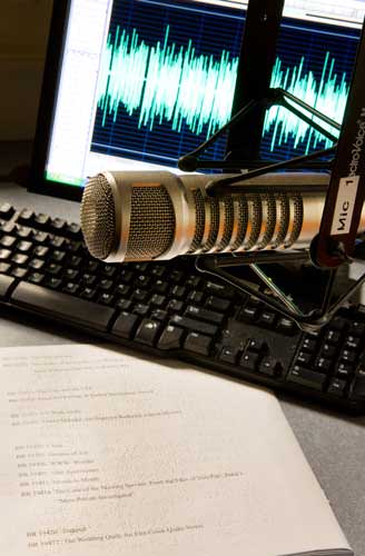 Graphics photo of microphone and computer screen displaying sound waves.
