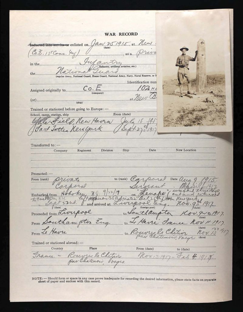 an official state of connecticut military service record for raymond joseph queenin with a photo of him in his military uniform standing in a field